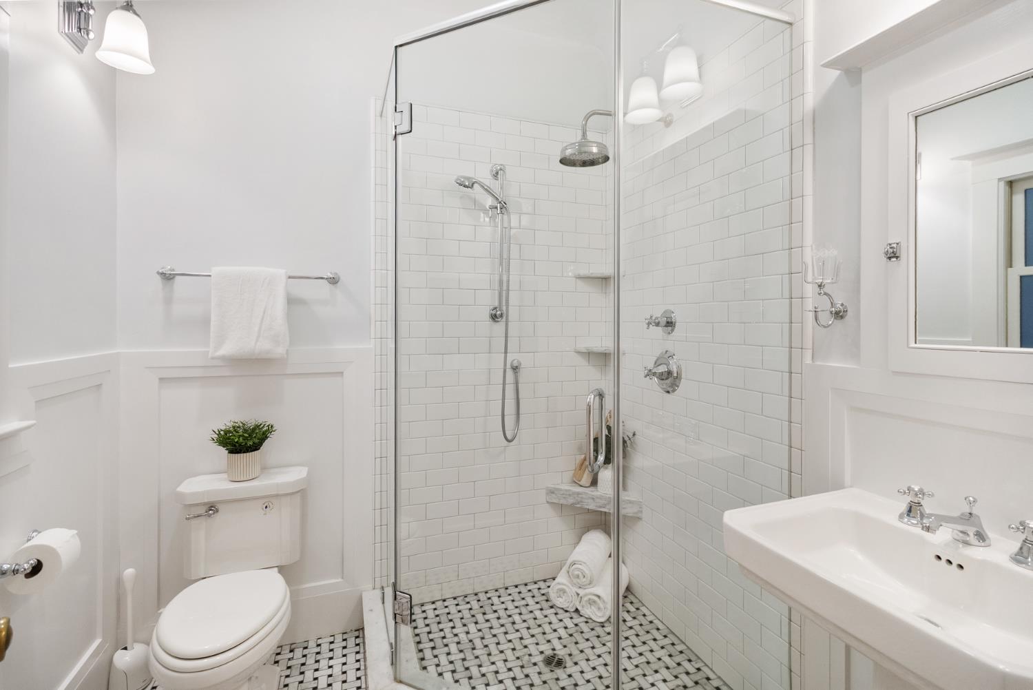 1705 H Street Sacramento, CA 95811 - Photo 27 of 50 a bathroom with a toilet a sink and shower