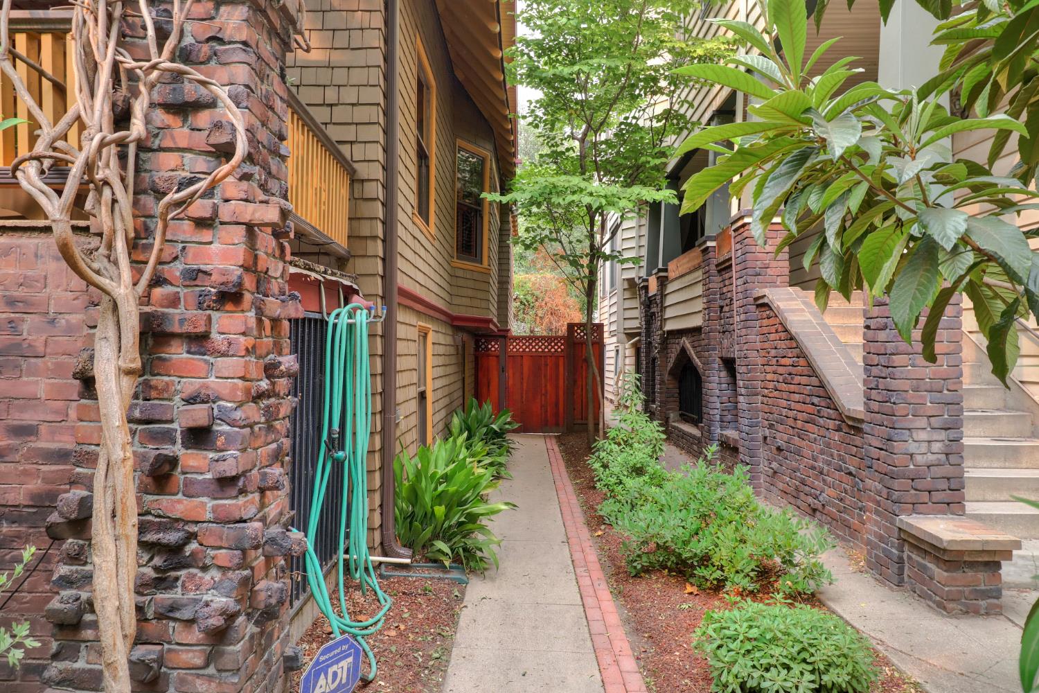 1705 H Street Sacramento, CA 95811 - Photo 49 of 50 a pathway of a house with a yard