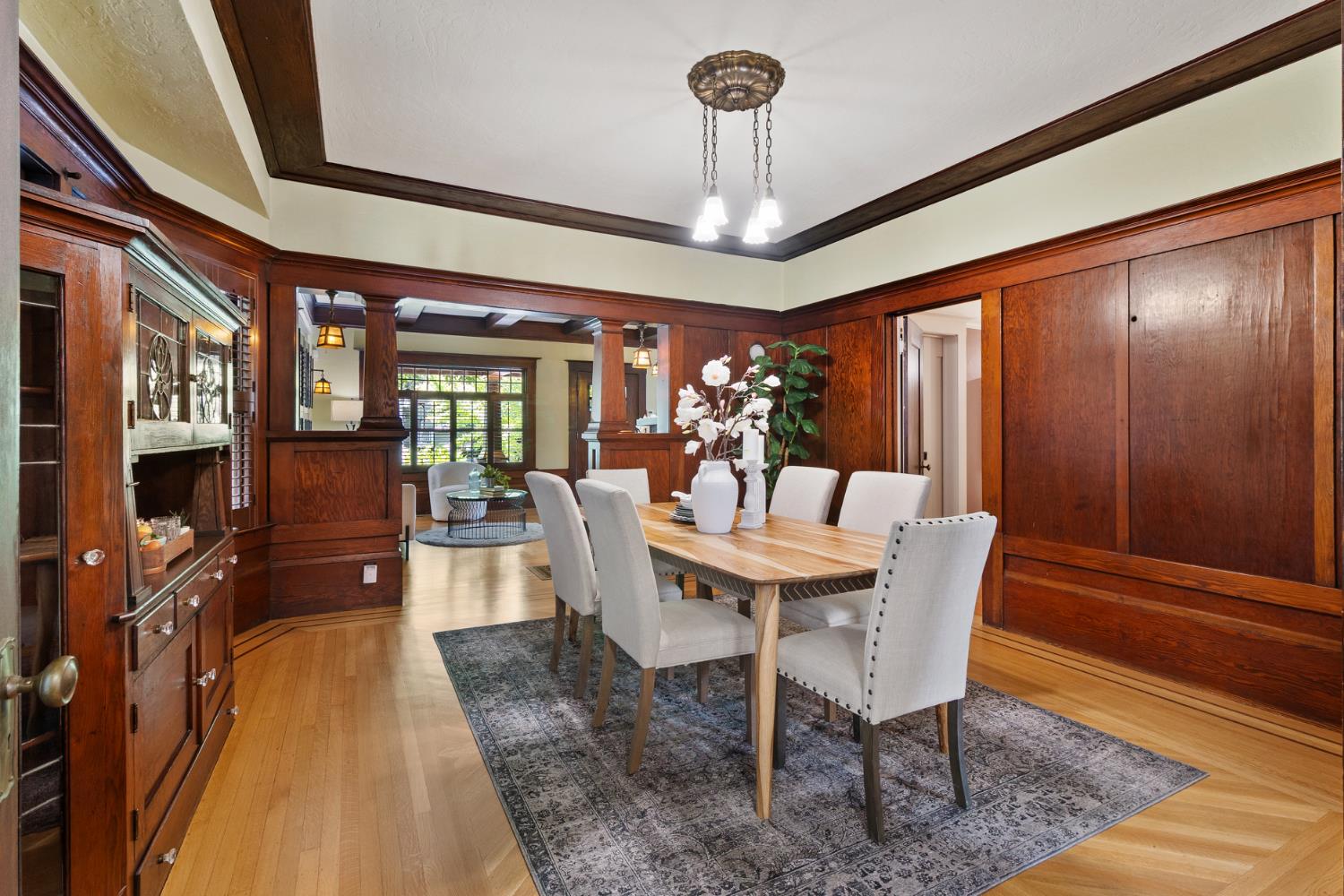1705 H Street Sacramento, CA 95811 - Photo 9 of 50 a view of a dining room with furniture a chandelier and wooden floor