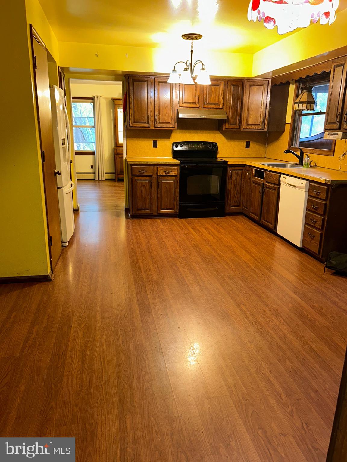 1535 Fieldwood Road Southampton, PA 18966 - Photo 12 of 33 a large kitchen with stainless steel appliances wooden floors stove top oven and sink
