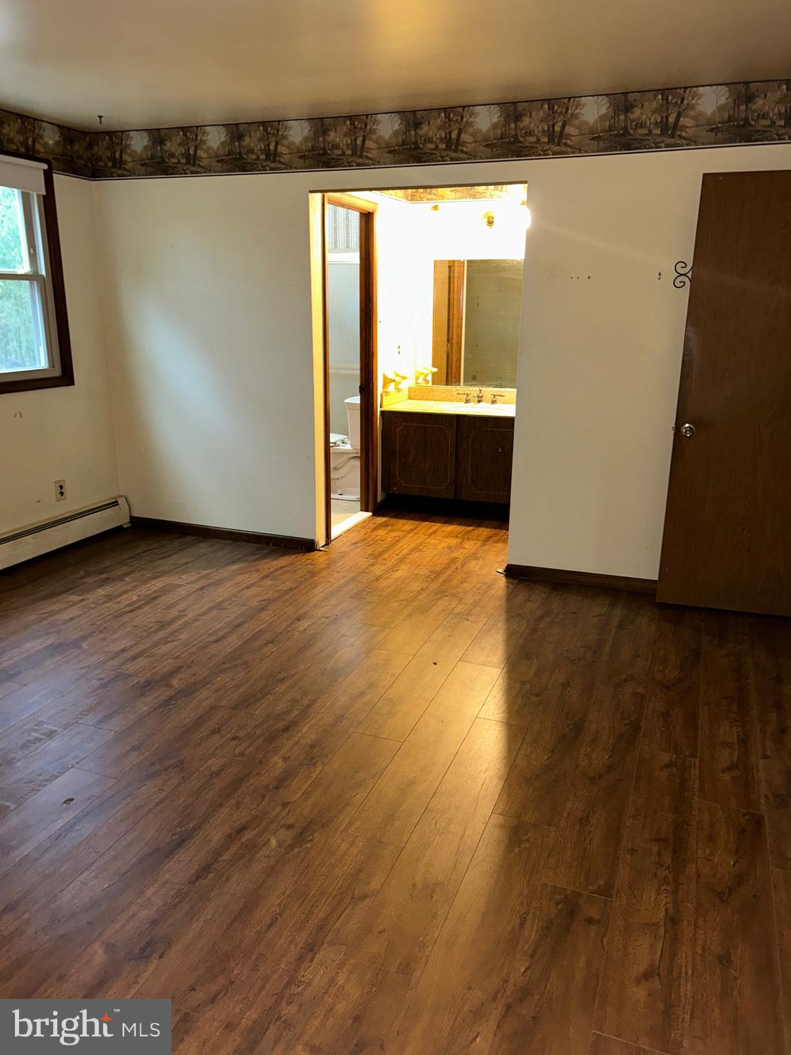 1535 Fieldwood Road Southampton, PA 18966 - Photo 28 of 33 an empty room with wooden floor and windows