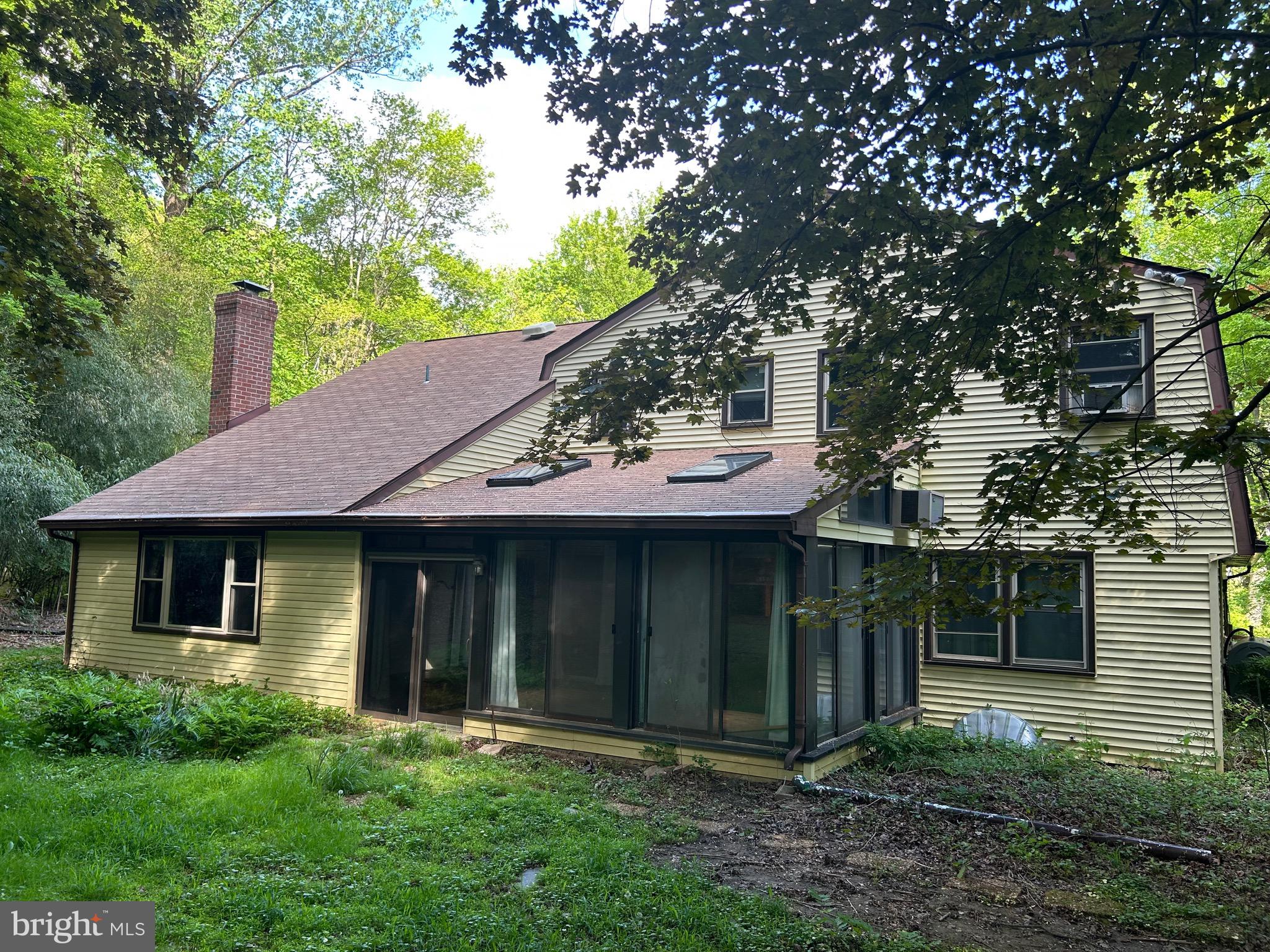 1535 Fieldwood Road Southampton, PA 18966 - Photo 5 of 33 a view of a brick house with a large windows and a large tree