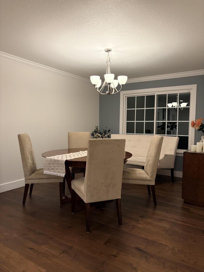 1204 Lubich Drive Mountain View, CA 94040 - Photo 11 of 12 a view of a dining room with furniture and wooden floor