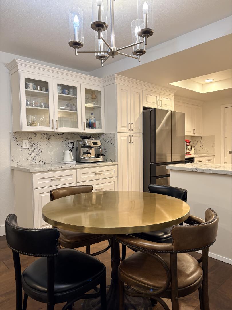 1204 Lubich Drive Mountain View, CA 94040 - Photo 4 of 12 a kitchen with a table chairs stove and refrigerator