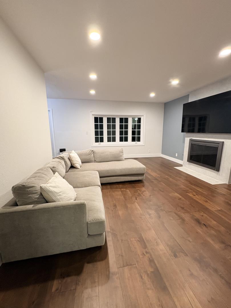 1204 Lubich Drive Mountain View, CA 94040 - Photo 7 of 12 a living room with furniture and a flat screen tv