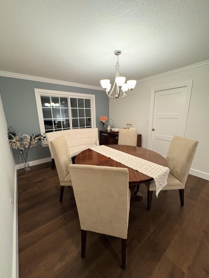 1204 Lubich Drive Mountain View, CA 94040 - Photo 10 of 12 a view of a dining room with furniture and wooden floor