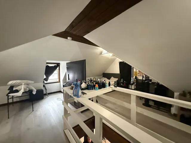a view of a livingroom with furniture and window
