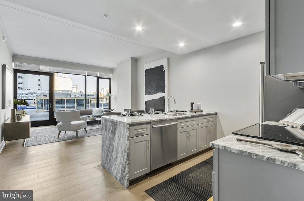 30 North 23rd Street Philadelphia, PA 19103 - Photo 11 of 26 a open kitchen with sink stove and cabinets