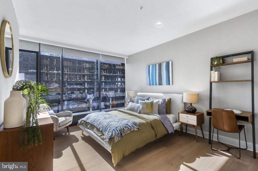 30 North 23rd Street Philadelphia, PA 19103 - Photo 18 of 26 a bedroom with a large bed and a potted plant