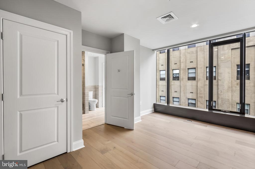 30 North 23rd Street Philadelphia, PA 19103 - Photo 23 of 26 an empty room with large windows and couch