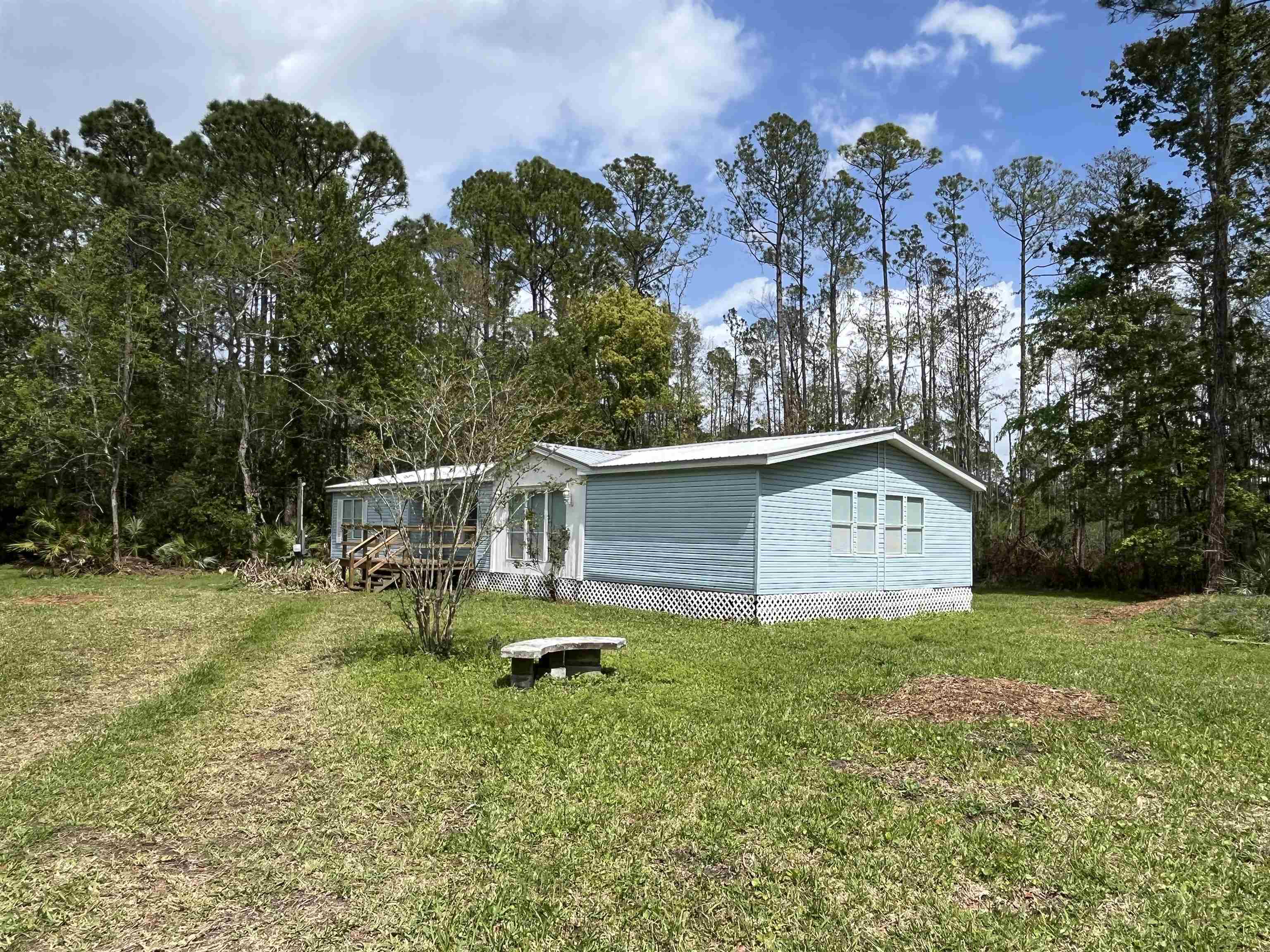 1340 Thompson Bailey Road St. Augustine, FL 32084 - Photo 3 of 21 a view of backyard with a garden and entertaining space