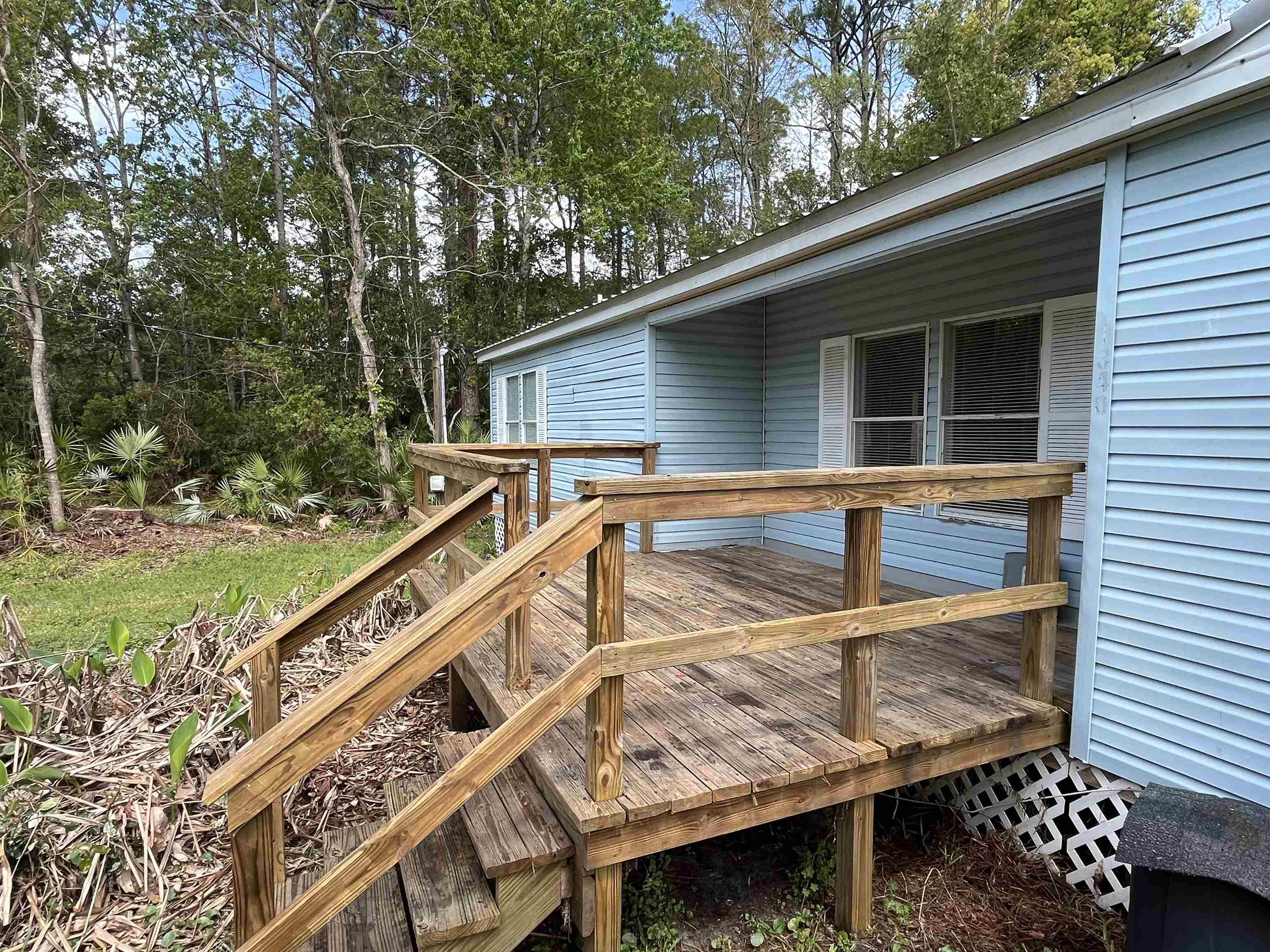 1340 Thompson Bailey Road St. Augustine, FL 32084 - Photo 5 of 21 a view of a house with backyard and sitting area