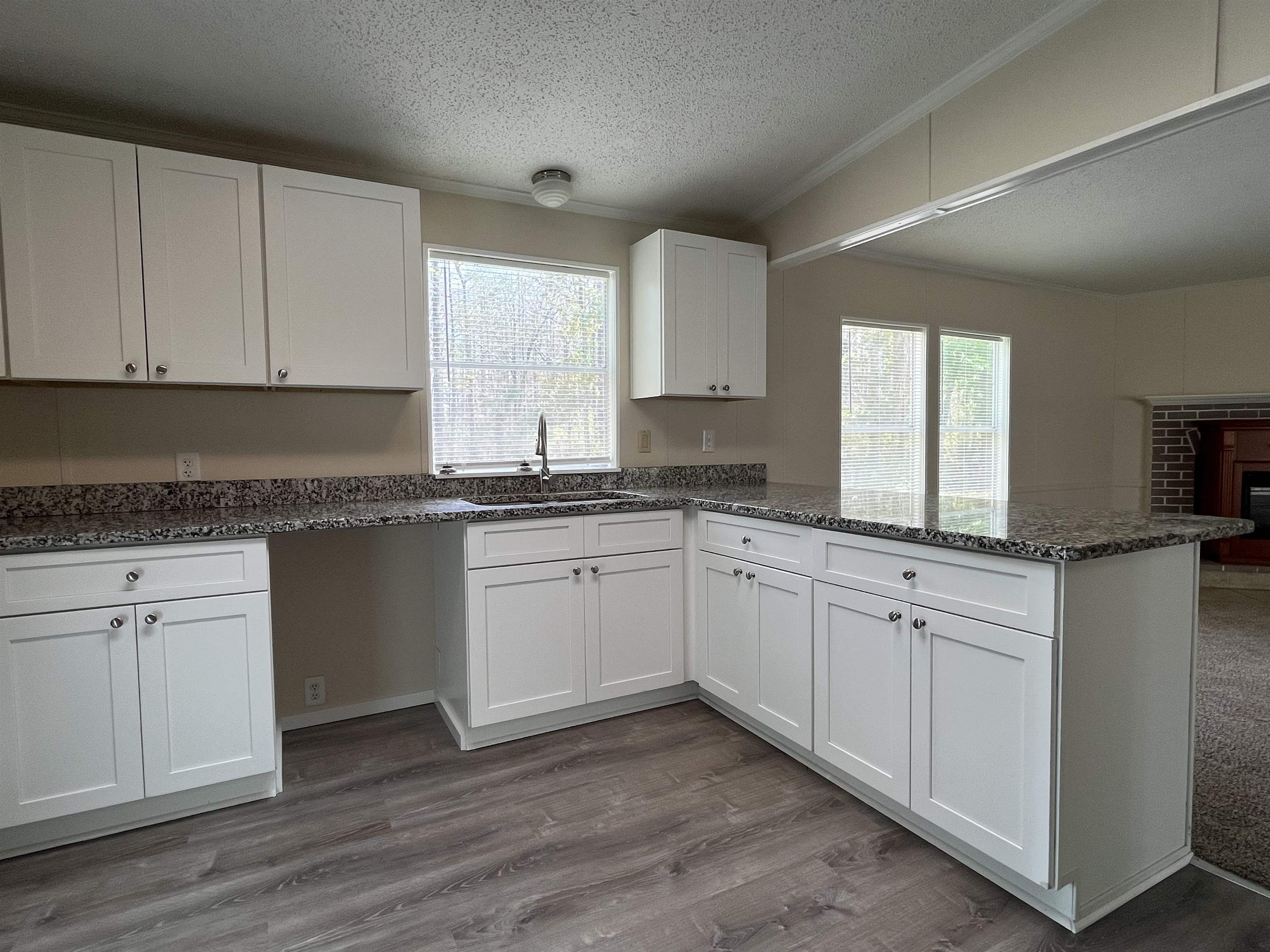 1340 Thompson Bailey Road St. Augustine, FL 32084 - Photo 8 of 21 a kitchen with granite countertop white cabinets and white appliances