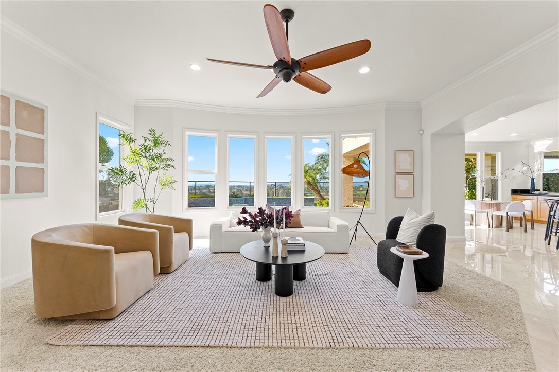 5464 Shannon Ridge Lane San Diego, CA 92130 - Photo 11 of 44 a living room with furniture gym equipment and a large window