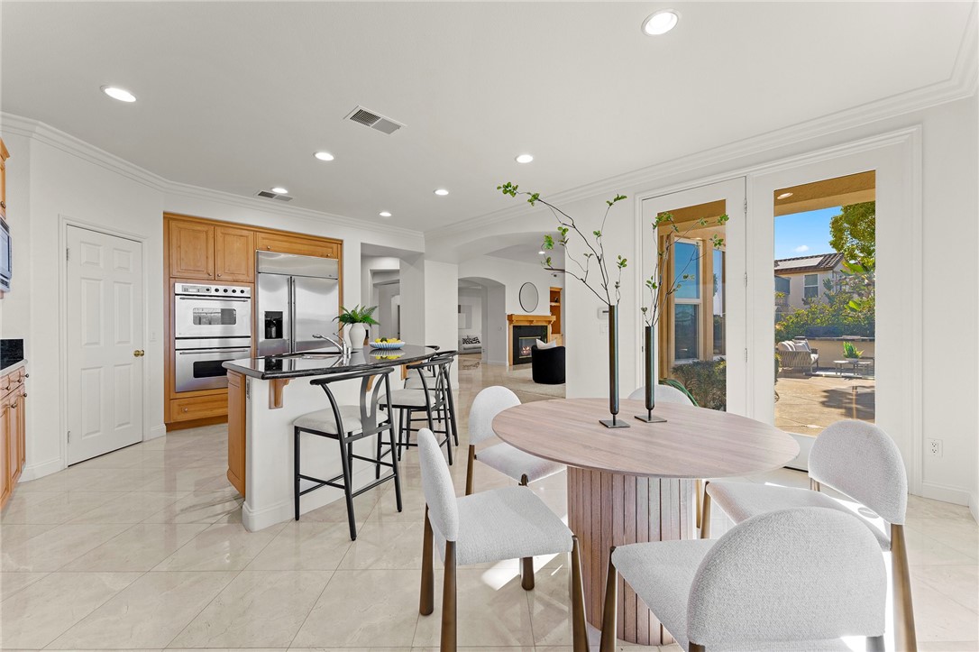 5464 Shannon Ridge Lane San Diego, CA 92130 - Photo 15 of 44 a view of a dining room with furniture and a livingroom
