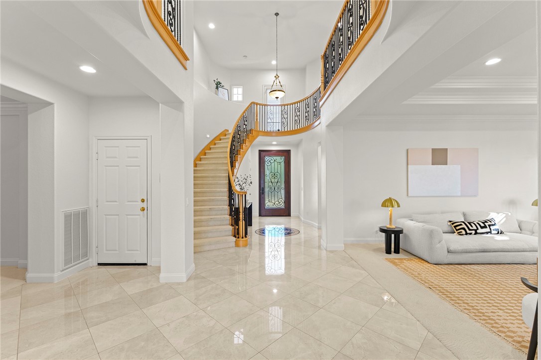 5464 Shannon Ridge Lane San Diego, CA 92130 - Photo 5 of 44 a hallway with furniture and a large window