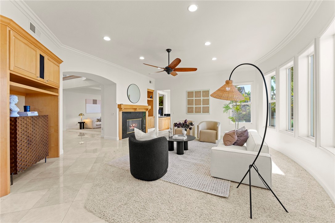 5464 Shannon Ridge Lane San Diego, CA 92130 - Photo 10 of 44 a living room with furniture a fireplace and a large window