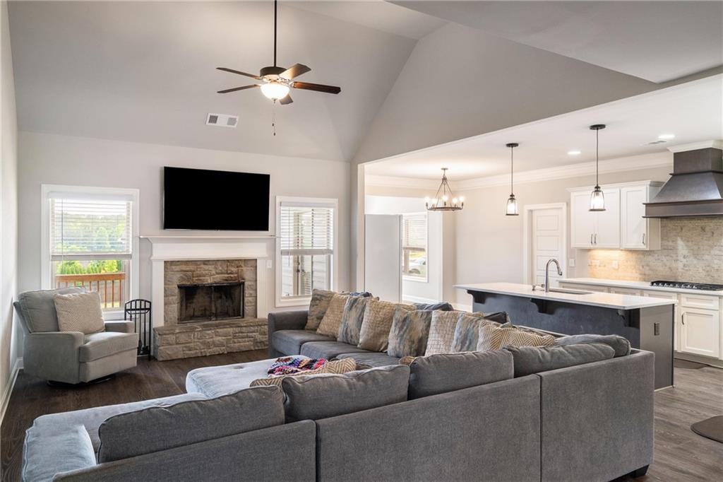 712 Fleeting Way Monroe, GA 30655 - Photo 10 of 29 a living room with furniture fireplace and a flat screen tv