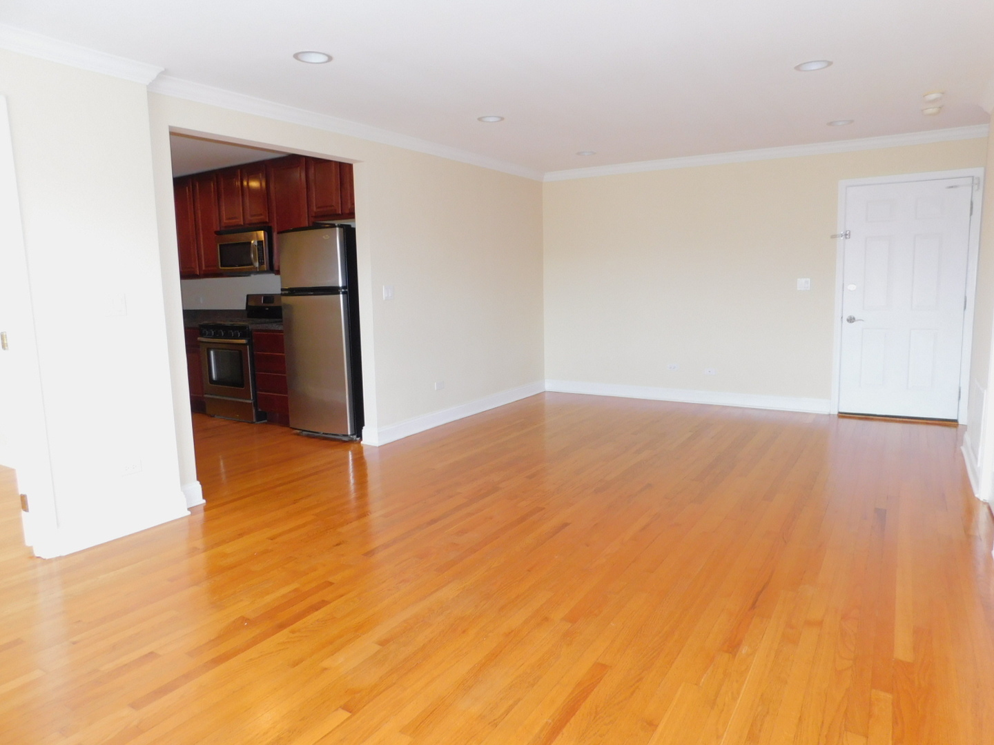 515 Sheridan Road, Unit 202 Evanston, IL 60202 - Photo 3 of 13 a view of kitchen and hallway with wooden floor