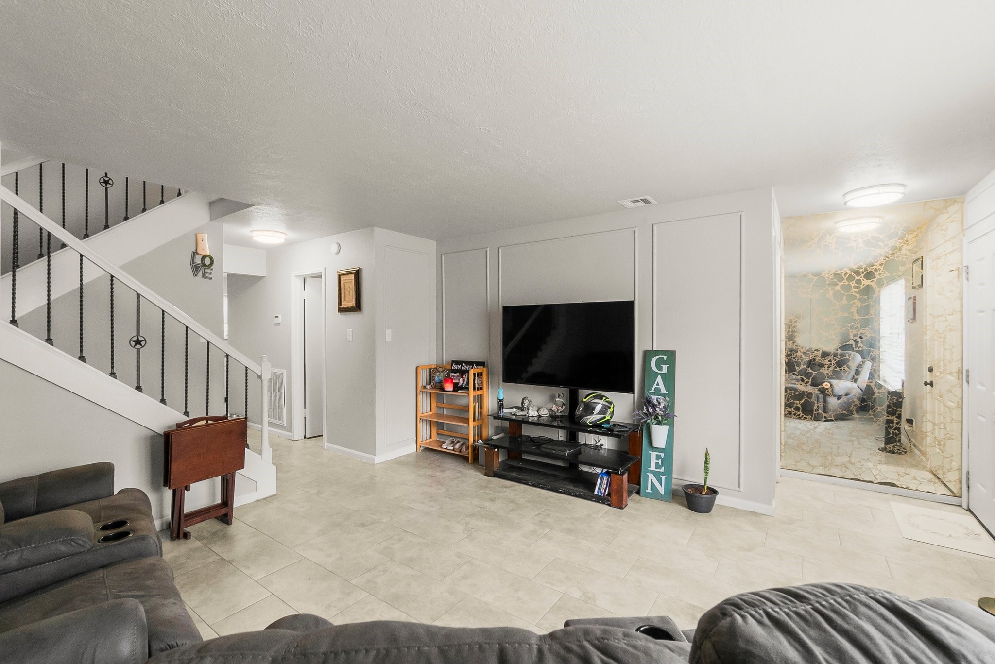 407 West Semands Street Conroe, TX 77301 - Photo 28 of 28 a view of a livingroom with furniture and a flat screen tv