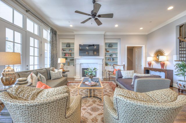 a large bathroom with a granite countertop sink a toilet and a bathtub
