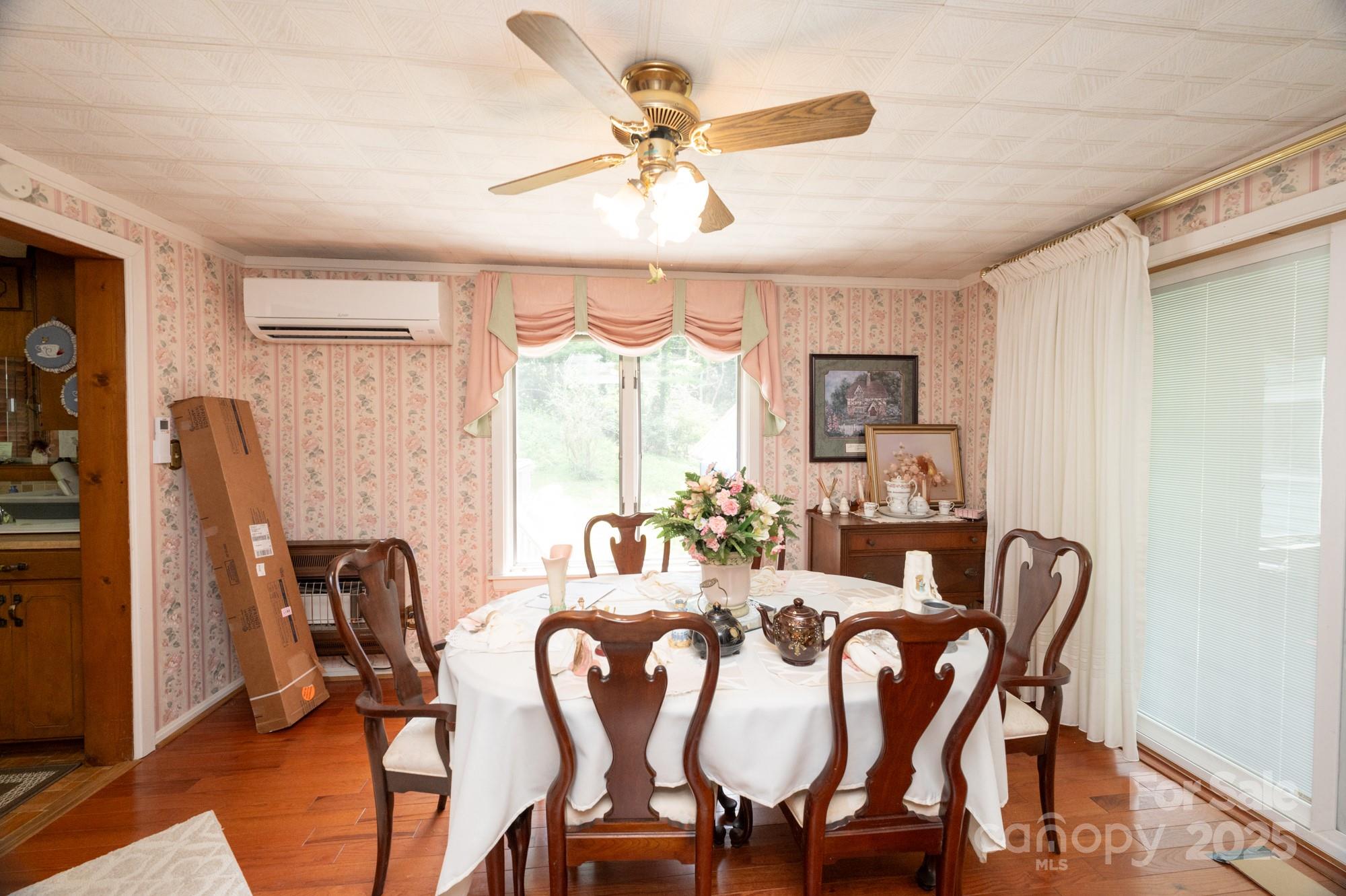 230 West Cove Lane Boone, NC 28607 - Photo 16 of 46 a view of a dining room with furniture window and wooden floor