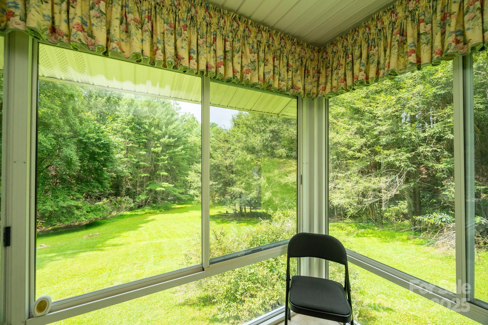230 West Cove Lane Boone, NC 28607 - Photo 21 of 46 a view of a large window with an outdoor space