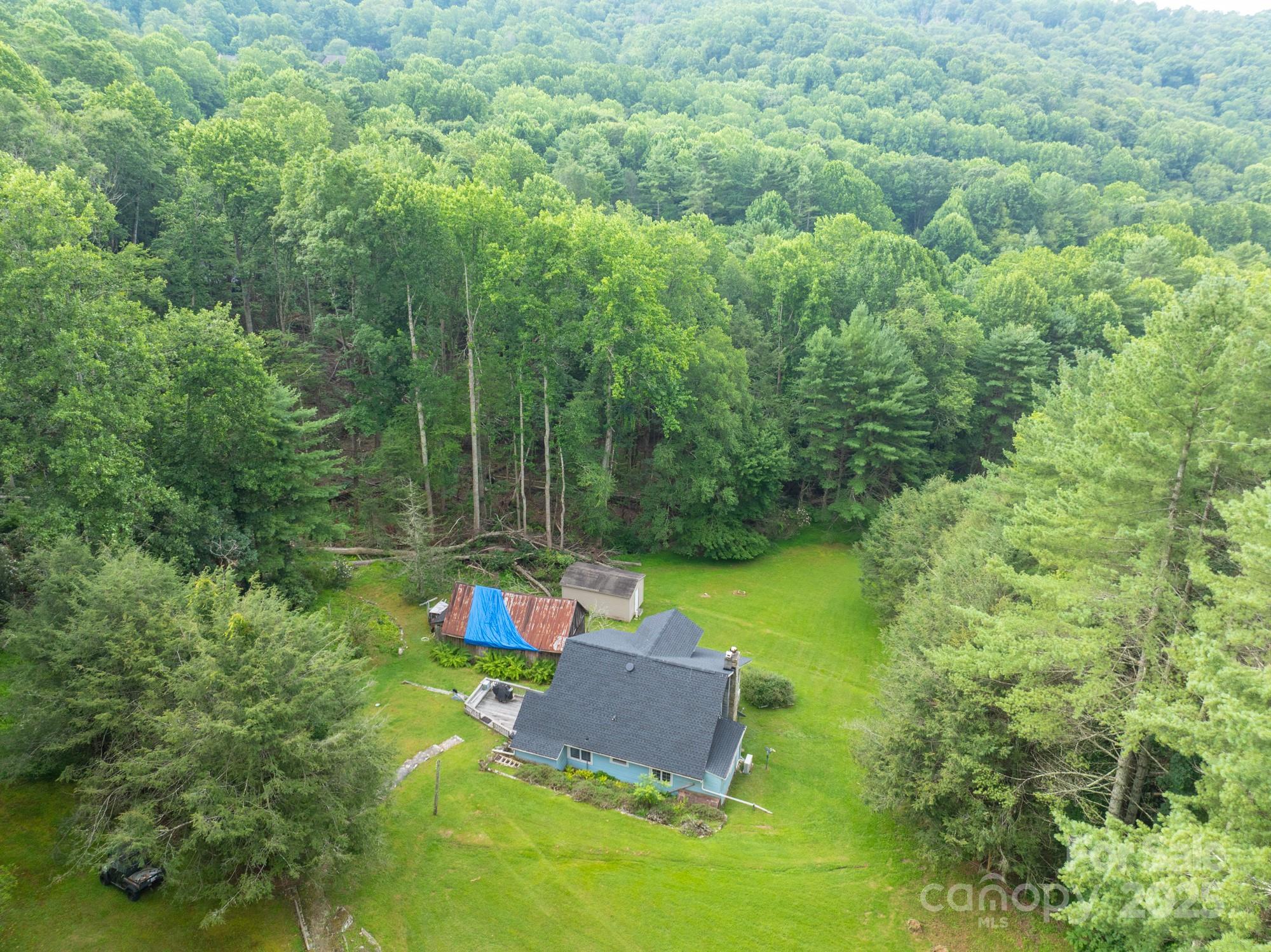 230 West Cove Lane Boone, NC 28607 - Photo 26 of 46 an aerial view of a house with pool outdoor space and garden