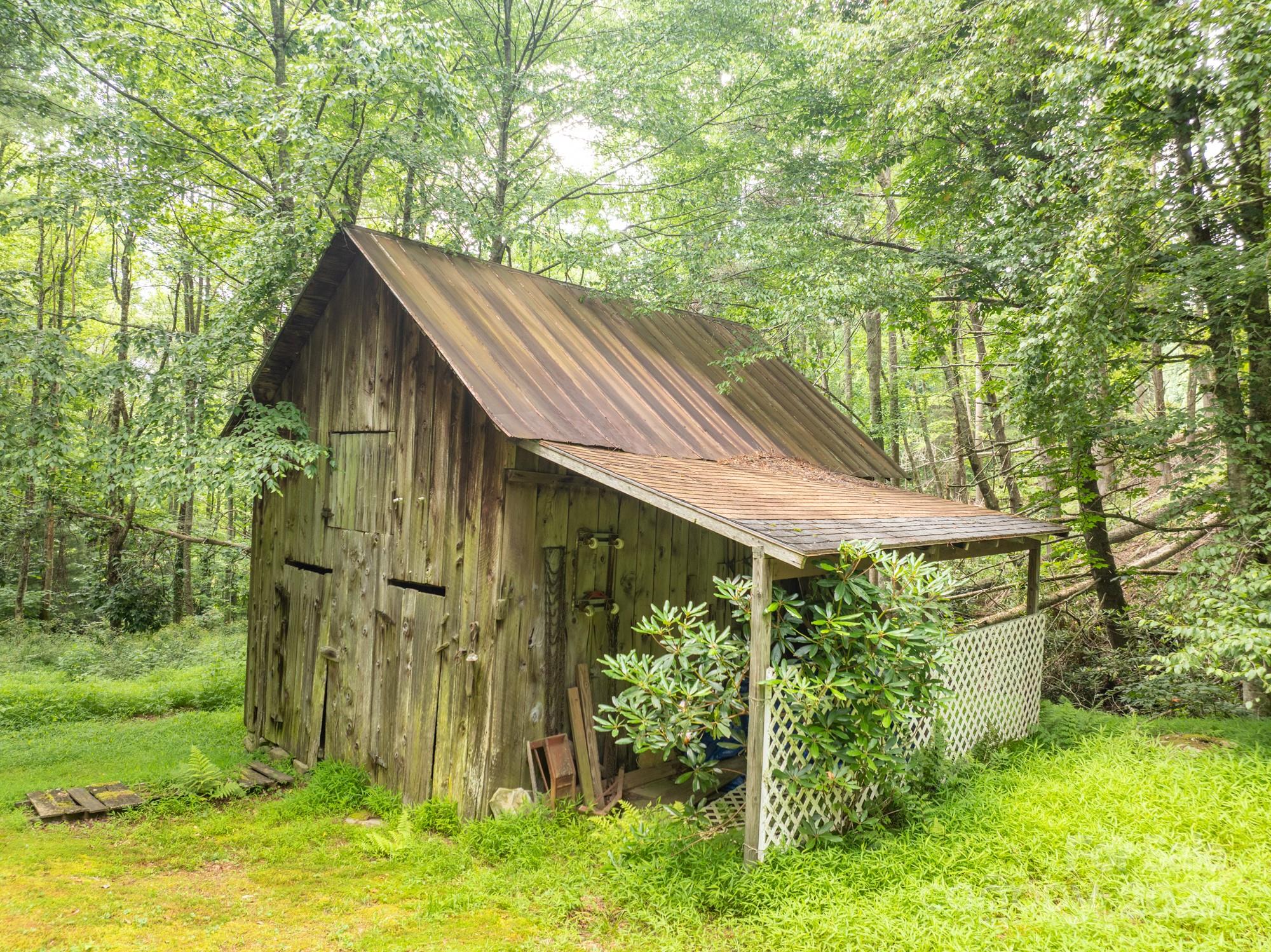 230 West Cove Lane Boone, NC 28607 - Photo 27 of 46 a backyard of a house with lots of green space