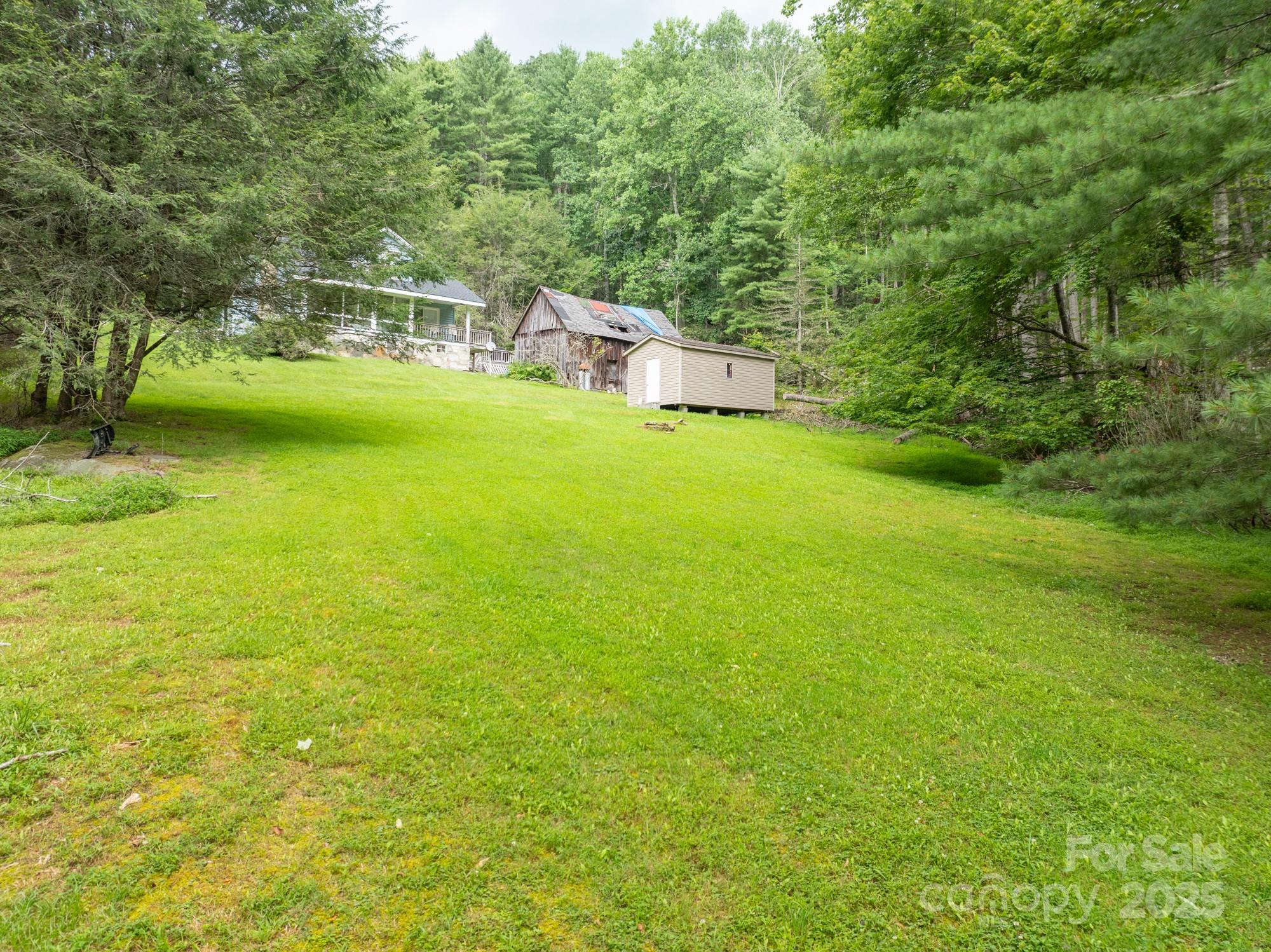 230 West Cove Lane Boone, NC 28607 - Photo 38 of 46 a view of a house with a yard