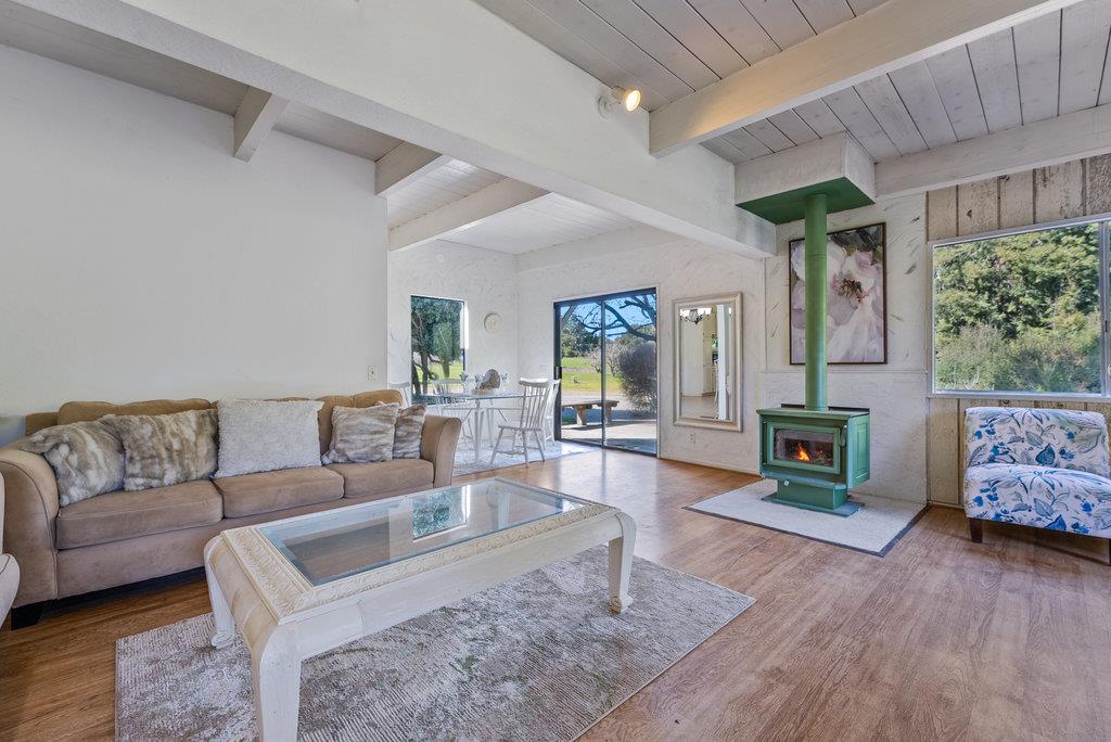 500 Valencia School Road Aptos, CA 95003 - Photo 11 of 44 a living room with furniture and a fireplace
