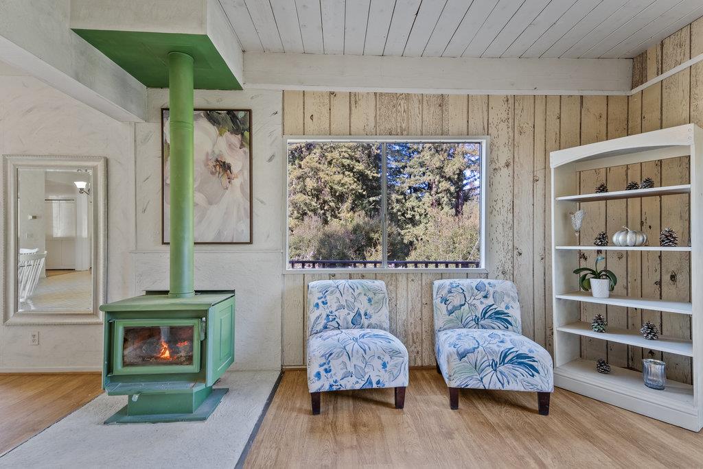 500 Valencia School Road Aptos, CA 95003 - Photo 12 of 44 a bedroom with furniture and a wooden floor