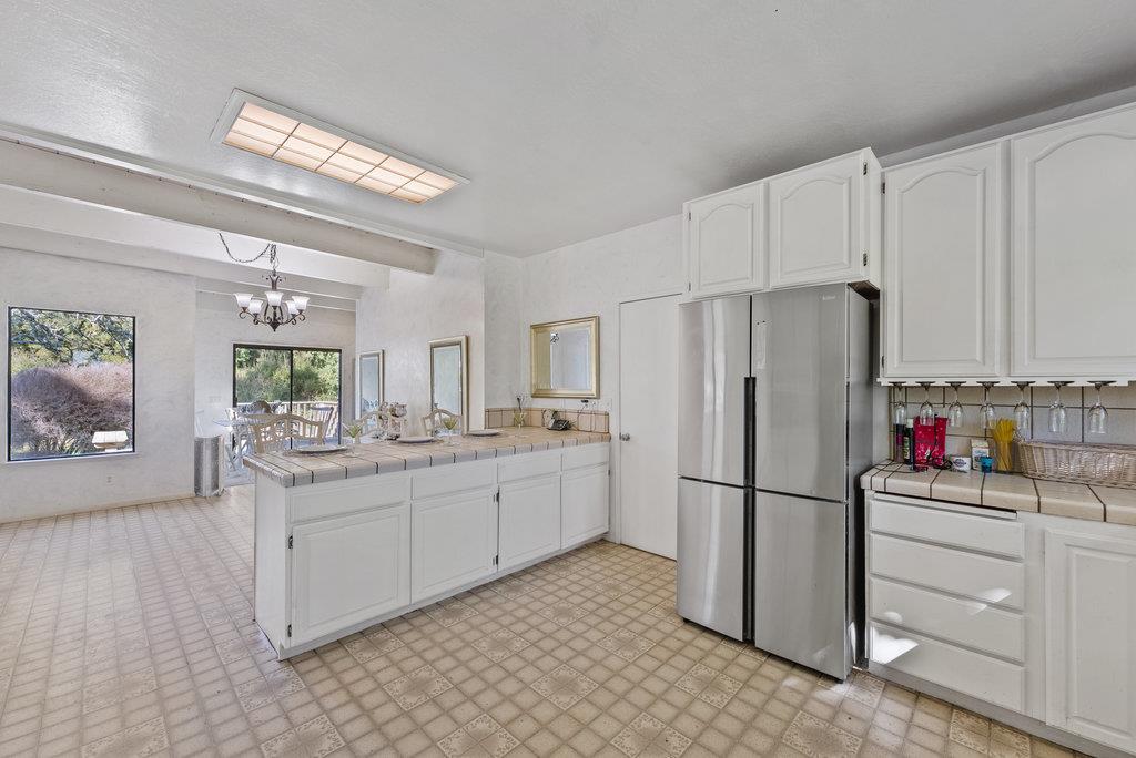 500 Valencia School Road Aptos, CA 95003 - Photo 17 of 44 a kitchen with stainless steel appliances a refrigerator sink and cabinets