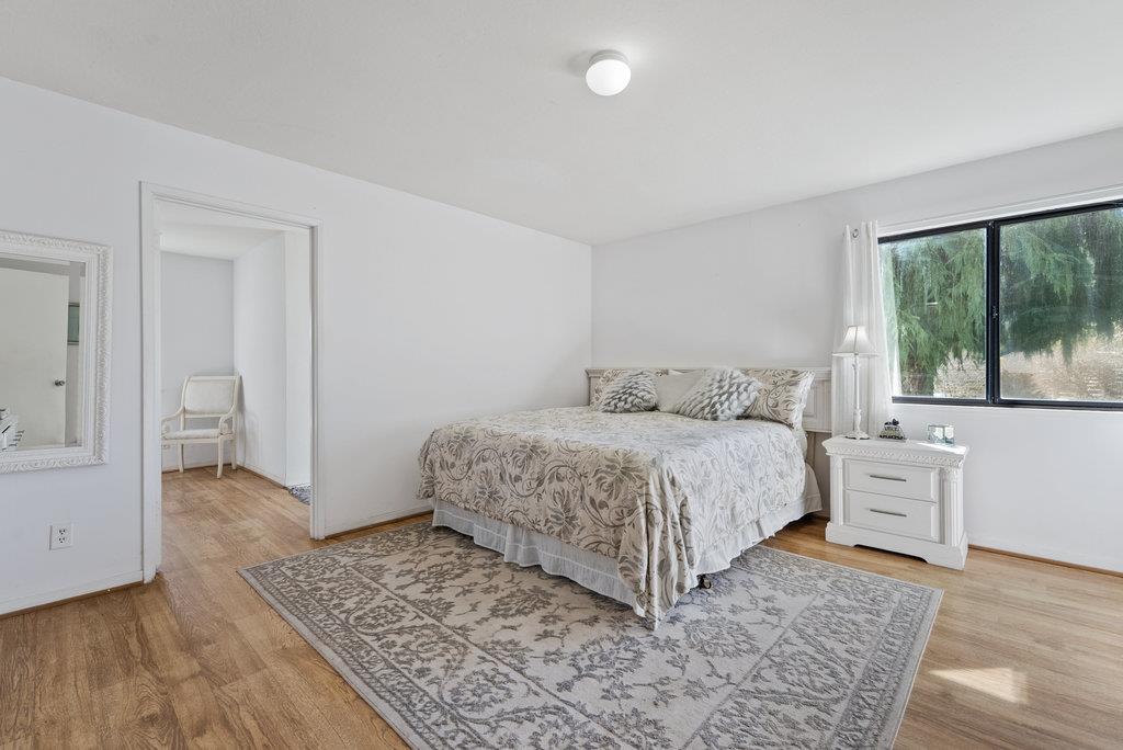 500 Valencia School Road Aptos, CA 95003 - Photo 18 of 44 a bedroom with a bed and large window
