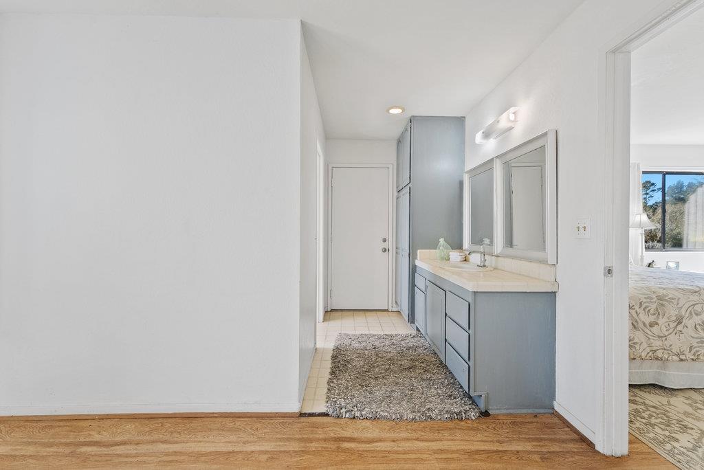 500 Valencia School Road Aptos, CA 95003 - Photo 21 of 44 a bathroom with a sink a mirror and a shower