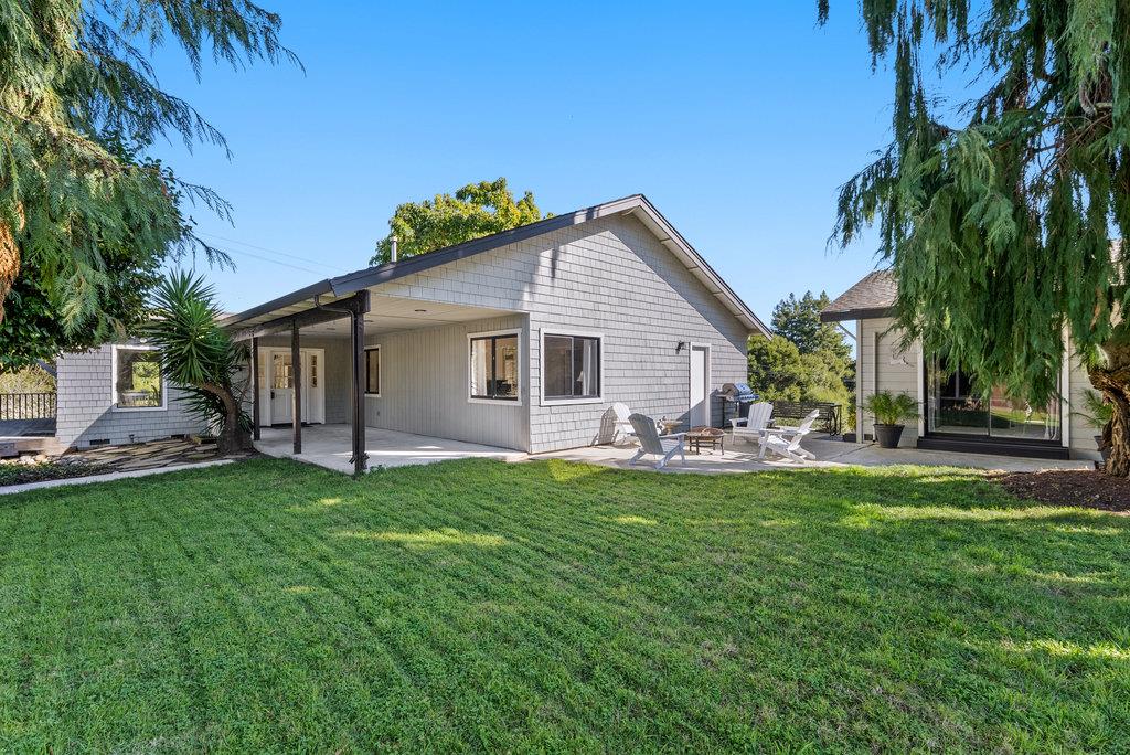 500 Valencia School Road Aptos, CA 95003 - Photo 34 of 44 a view of a house with a backyard and a tree