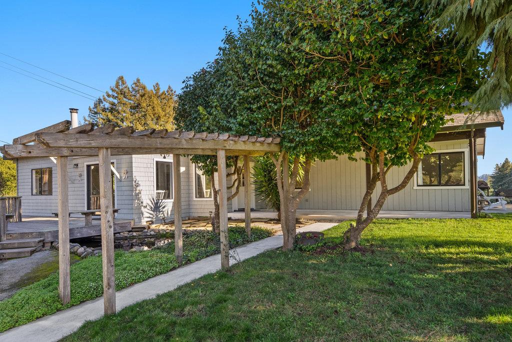 500 Valencia School Road Aptos, CA 95003 - Photo 35 of 44 a view of a house with backyard and a tree