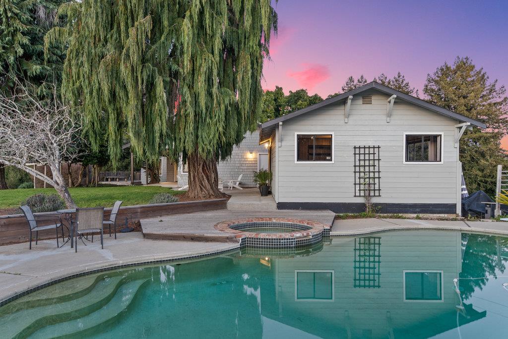 500 Valencia School Road Aptos, CA 95003 - Photo 4 of 44 a backyard of a house with table and chairs