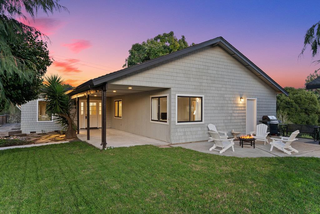 500 Valencia School Road Aptos, CA 95003 - Photo 5 of 44 a backyard of a house with table and chairs