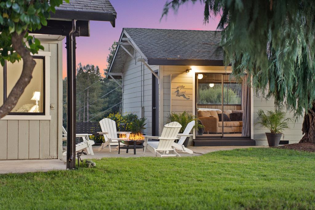 500 Valencia School Road Aptos, CA 95003 - Photo 6 of 44 a view of a patio with a table chairs and a yard