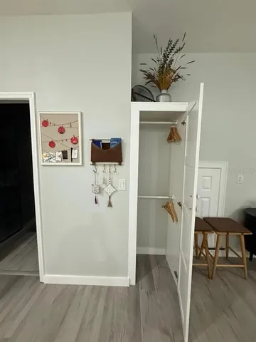 a view of a hallway with a dining area