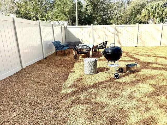 a view of swimming pool with a lounge chair