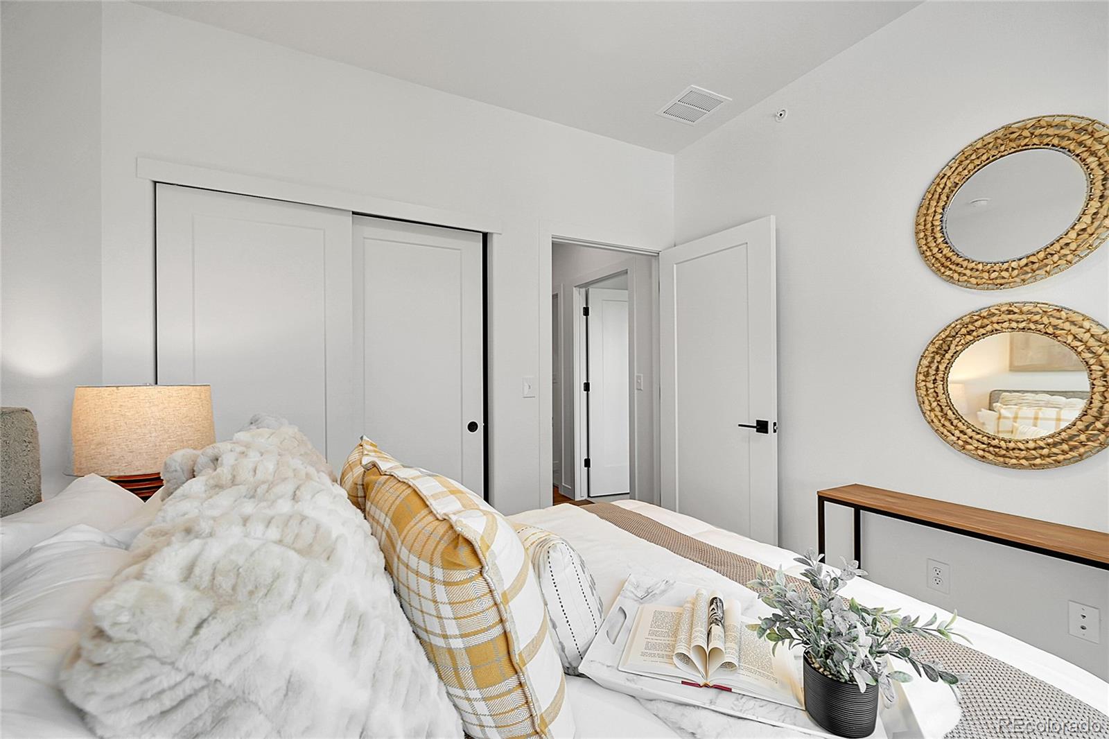 765 East County Line Road Erie, CO 80516 - Photo 14 of 28 a bedroom with a bed and closet