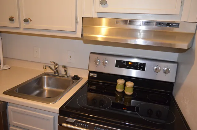 a close view of stove and microwave