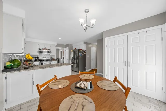 a bedroom with a bed and dresser