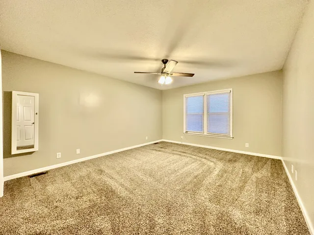 a bath room with sink and mirror