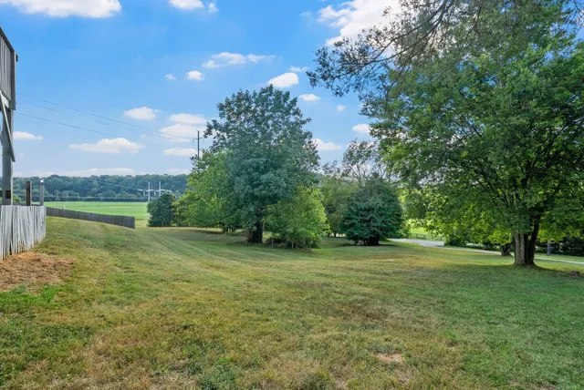 a view of lake with green space