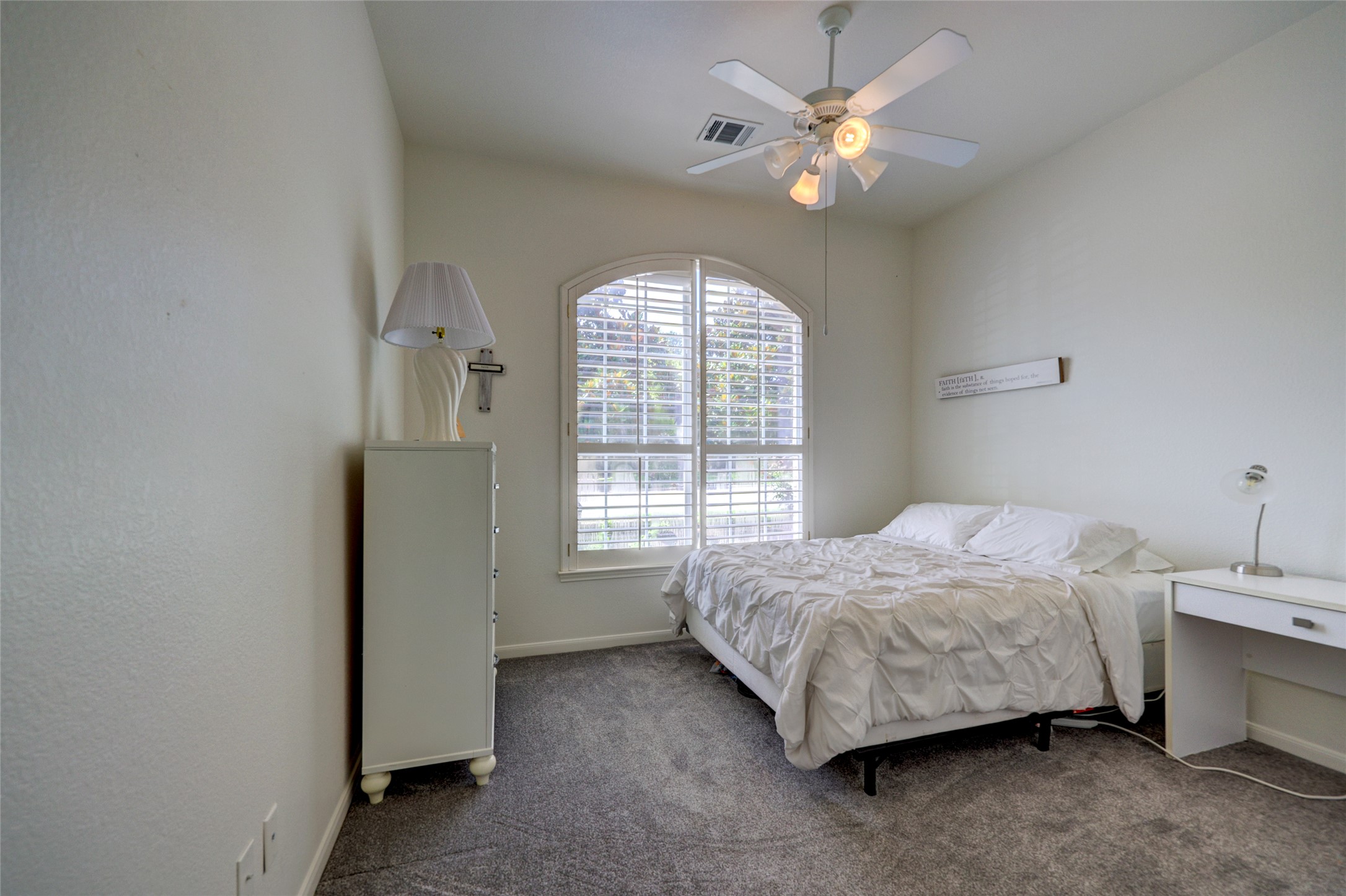 1819 Nelson Ranch Loop Cedar Park, TX 78613 - Photo 26 of 38 Bedroom 2 is at front of home with ceiling fan and plantation shutters
