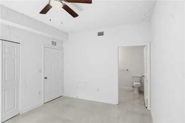 a bathroom with a toilet sink and a shower