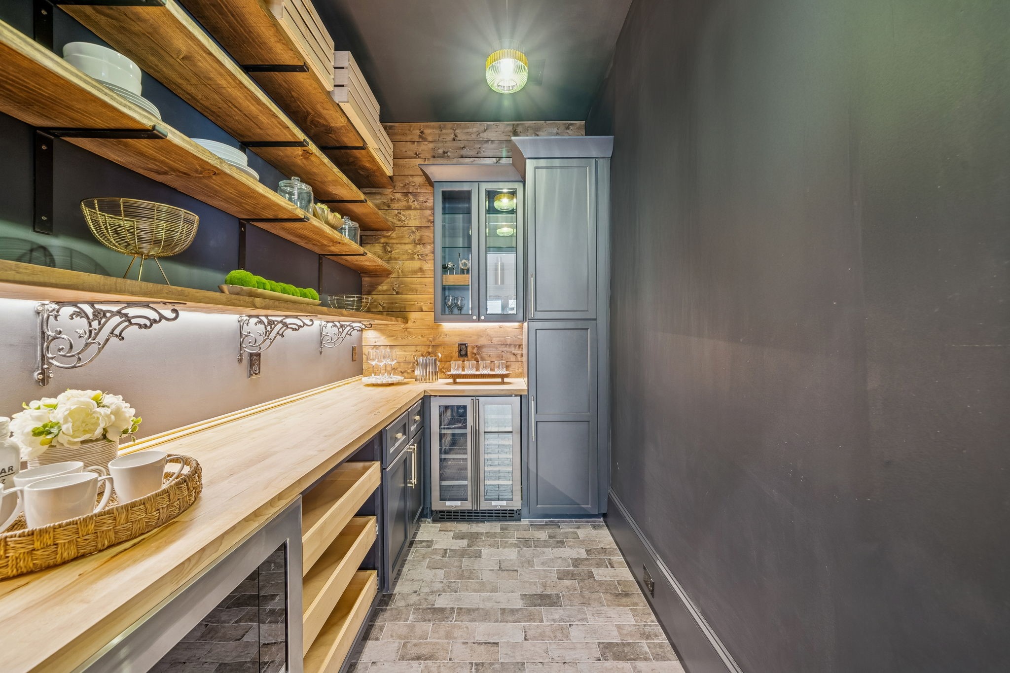 511 Graceland Street Houston, TX 77009 - Photo 14 of 43 Have you ever seen a pantry like this? A pocket door separates it from the kitchen. Beverage fridge and glass cabinets for your barware.